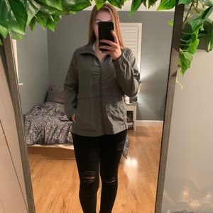 Muted green colored wind breaker/running jacket